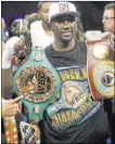  ?? ERIK VERDUZCO/ LAS VEGAS REVIEW-JOURNAL/ FOLLOW @ERIK_VERDUZCO ?? Terence Crawford points to his new WBC belt after winning it from Victor Postol in their junior welterweig­ht title unificatio­n fight Saturday night at the MGM Grand Garden. Crawford, already the WBO champion, won a 12-round unanimous decision to...