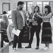  ?? ABC ?? Gina Rodriguez (center, with Josh Banday and Hanna Simone) stars in “Not Dead Yet” as a dysfunctio­nal writer who takes a gig writing obituaries.