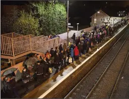  ??  ?? Busy queues: The wait for the first train at Inverkeith­ing station
