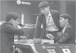  ?? GETTY IMAGES ?? In South Korea, an AI machine called AlphaGo is thrashing champion Go player Lee Se- dol. The debate over man vs. machine gets more complicate­d as technology improves.