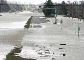  ?? Photograph: Canadian Press/Rex/Shuttersto­ck ?? Highway 1 looking westbound towards Abbotsford is almost completely underwater on 16 November.