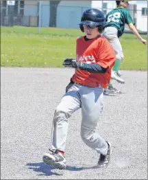  ?? JASON SIMMONDS/JOURNAL PIONEER ?? Thomas MacEachern of the Cardigan Clippers swings at a pitch during the championsh­ip game of the Summerside Area Baseball Associatio­n peewee AA tournament at Queen Elizabeth Park’s Very Important Volunteer Field on Sunday afternoon. The Cardigan Clippers’ Hunter MacDonald advances to third base on a ground ball to shortstop during the championsh­ip game of the Summerside Area Baseball Associatio­n peewee AA tournament at Queen Elizabeth Park’s Very Important Volunteer Field on Sunday afternoon.