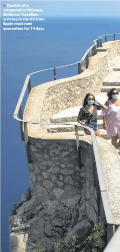  ??  ?? > Tourists at a viewpoint in Pollença, Mallorca. Travellers arriving in the UK from Spain must now quarantine for 14 days