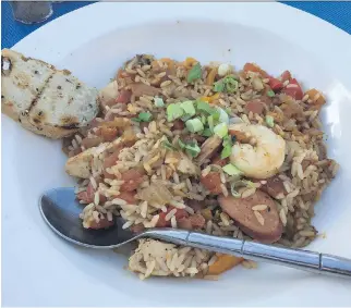  ?? PHOTOS: PETER HUM ?? South Branch Bistro’s jambalaya: shrimp, chicken and Andouille sausage, tossed in a tomato creole sauce, over a bed of rice and served with bread.