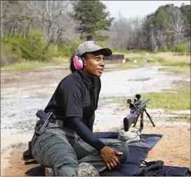  ?? REANN HUBER / REANN.HUBER@AJC.COM ?? Fulton County Sheriff’s Deputy LaShira Norwood works with a Remington 700 sniper rifle at the Hagins Firing Range in Atlanta on Monday.