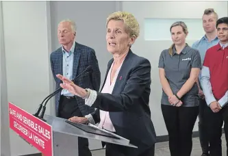  ?? CHRIS YOUNG THE CANADIAN PRESS ?? Ontario Liberal Leader Kathleen Wynne takes a question after making an announceme­nt at the Mothers Against Drunk Driving office in Toronto on Tuesday.