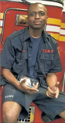  ??  ?? SMOKE & MIRRORS: Firefighte­r Roben Duge says his “racist” boss at East New York’s Ladder 103 won’t let him battle blazes, even after he helped pull a family from their burning home in March.