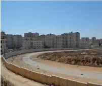  ?? (Udi Shaham) ?? KAFR AKAB, one of the neighborho­ods that falls under the purview of the suggested measure, lies just beyond the security fence.