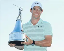  ?? Picture: Getty Images. ?? Rory Mcilroy of Northern Ireland holds the trophy after his victory in the Arnold Palmer Invitation­al.