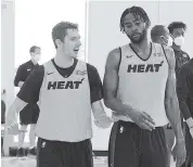  ?? COURTESY OF THE MIAMI HEAT ?? Heat forward Moe Harkless, right, practicing with veteran guard Goran Dragic, is an option to play as a stretch four who can defend multiple positions. Harkless said Heat culture is ‘ intense, it’s physical, it’s tough.’