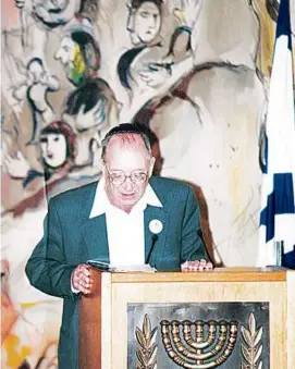  ?? YAD VASHEM/NEW YORK TIMES ?? Mr. Roet read names of Holocaust victims in the project “Unto Every Person There is a Name,” in an undated photo.