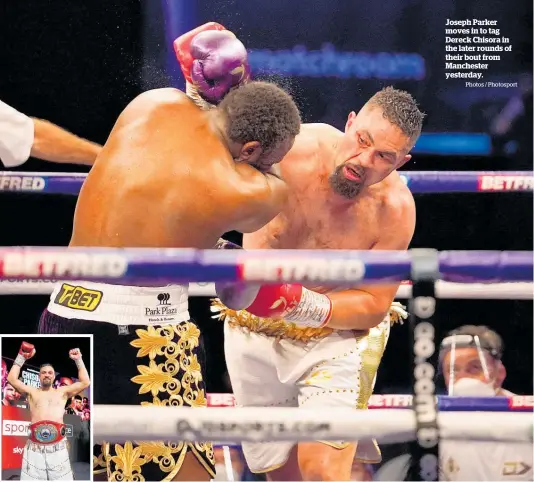  ?? Photos / Photosport ?? Joseph Parker moves in to tag Dereck Chisora in the later rounds of their bout from Manchester yesterday.