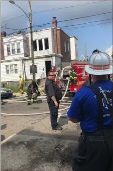  ?? KATHLEEN E. CAREY - MEDIANEWS GROUP ?? Darby Fire Captain Jimmy Watts oversees the scene at a house fire on North Third Street in Darby Borough.