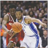  ?? (AP/Gerry Broome) ?? North Carolina State guard Markell Johnson (11) and Duke guard Cassius Stanley (2) chase the ball Monday during the first half of an NCAA basketball game in Durham, N.C.