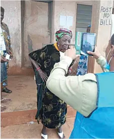 ?? ?? A- 105 year- old Felicia Fayomi being accredited before voting at Unit 6, Ward 2, Uro Ifaki,