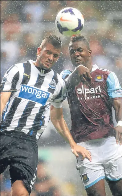  ??  ?? n Newcastle defender Davide Santon and West Ham striker Modibo Maiga challenge for the ball.