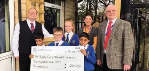  ??  ?? The East Ribble Masonic Charity Fund gave St Paul’s £250, which will be used to fund a prayer chair and quiet area in the school yard