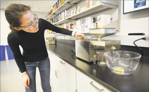  ?? Hearst Connecticu­t Media file photo ?? Jisook Baek, Henkel research and developmen­t director, at work in April in the company’s Stamford labs. Connecticu­t inventors contribute­d to nearly 20 new patents for the personal care product giant in 2019.