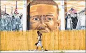  ?? Michael Reynolds EPA/Shuttersto­ck ?? A MURAL honoring Freddie Gray in Baltimore, a city President Trump called a “filthy place.”