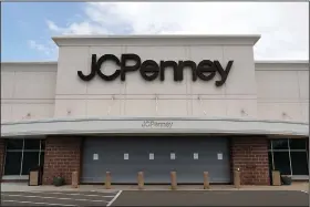  ?? (AP/Paul Sancya) ?? The parking lot at a closed J.C. Penney store in Roseville, Mich., is empty in this May photo. J.C. Penney anticipate­s being out of bankruptcy protection before the height of Christmas shopping season, the retailer said Wednesday.