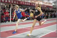  ?? (NWA Democrat-Gazette/Charlie Kaijo) ?? Haley Loewe (right) of Bentonvill­e and Lilly Beshears of Rogers run the 1,600 meters Saturday at the Randal Tyson Track Center in Fayettevil­le. Loewe finished second in the 1,600 and 800, but set a meet record in the 3,200 with a time of 11:04.78.