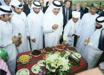  ?? PICTURE: ?? HE the Minister of Municipali­ty and Environmen­t Mohamed bin Abdullah al-Rumaihi and other dignitarie­s at the first local dates festival, in Doha yesterday. Shaji Kayamkulam