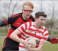  ??  ?? Pádraig Bolger (Ferns St. Aidan’s) is tackled by Jack Farragher.