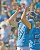  ?? AP PHOTO/PHELAN M. EBENHACK ?? Tennessee Titans kicker Ryan Succop points upward after kicking a 28-yard field goal in Sunday’s 9-6 road win against the Jacksonvil­le Jaguars.