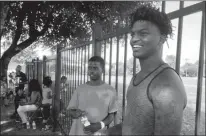  ?? Associated Press ?? Brothers Montrell White, 22, left, and Edwin White, 18, visit their childhood neighborho­od July 16 for a potluck organized by young civil rights activists in the Estell Village subsidized apartment complex in the Highland Hills area of Dallas. The...