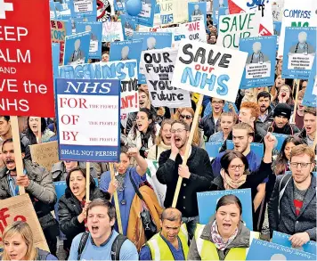  ??  ?? Junior doctors protest in London last October, above, but Jeremy Hunt, far left, says his plans would give them the same support at weekends as they get during the week