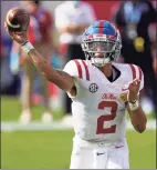  ?? Chris O’Meara / Associated Press ?? Ole Miss quarterbac­k Matt Corral passes against Indiana during the Outback Bowl on Saturday.