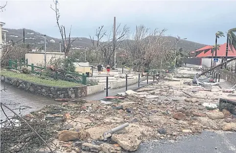  ?? AFP / FACEBOOK: KEVIN BARRALLON ?? A street in Gustavia, St Barthelemy, is left badly damaged by Hurricane Irma yesterday.