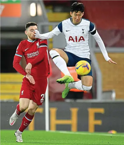  ?? PICTURE: REUTERS ?? Flying high: Son leaps into action at Anfield in the top-of-the-table clash with Liverpool