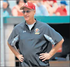  ?? /JOE RAYMOND, POST-TRIBUNE ?? Andrean coach Dave Pishkur talks to the umpires prior to their game with Heritage in the semistate game.