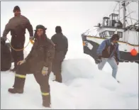  ?? PHOTO COURTESY OF DAVE PATEY ?? A group of sealers travel across the pans of of ice.