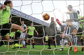  ??  ?? NET GAINS: Gareth McAuley (right) scores West Brom’s second goal as the