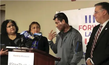  ??  ?? Mahud Villalaz, 42, of Milwaukee gestures to the second-degree burns on his face at a news conference one day after a man threw acid at him outside a restaurant on Milwaukee’s south side. Photograph: Sophie Carson/AP