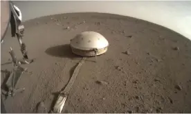  ?? Photograph: AP ?? Nasa image showing the InSight lander’s dome-covered seismomete­r on Mars.