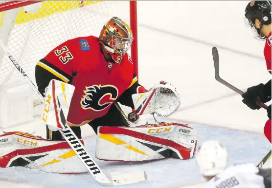  ?? DARREN MAKOWICHUK ?? David Rittich corrals a Vegas Golden Knights shot Monday at the Scotiabank Saddledome. Rittich has been capturing the imaginatio­n of fans with his strong play.