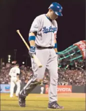  ?? Jason O. Watson Getty Images ?? A.J. ELLIS didn’t really need a bat during the Dodgers’ scoreless three-game series in San Francisco.