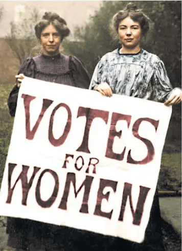  ??  ?? A recently colourised photograph of Annie Kenney, left, and Christabel Pankhurst, key members of the Women’s Social and Political Union, which was instrument­al in winning voting rights for some women 100 years ago today