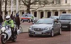  ?? AFP PIC ?? The Jaguar of British prime minister Theresa May with a security detail and outriders in London on Thursday.