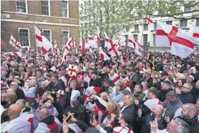  ?? PHOTOGRAPH: JORDAN PETTITT/PA WIRE ?? People waving England flags during a St George’s Day event that took place in central London yesterday