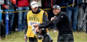  ?? Reuters ?? Spain’s Sergio Garcia holds his shoulder as he stands by the fourth green. —