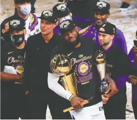  ?? MIKE EHRMANN/ GETTY IMAGES ?? Playoff MVP LeBron James and the Los Angeles Lakers may return to the court just 73 days after vanquishin­g the Miami Heat to claim the NBA title on Oct. 11.