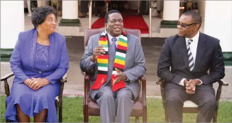  ??  ?? President Mnangagwa is flanked by Deputy Chief Justice Elizabeth Gwaunza (left) and chairman of the Public Service Commission Dr Vincent Hungwe after their swearing-in at State House in Harare yesterday. -(Picture by Innocent Makawa)