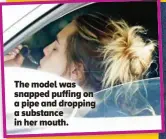 ?? ?? The model was snapped puffing on a pipe and dropping a substance in her mouth.