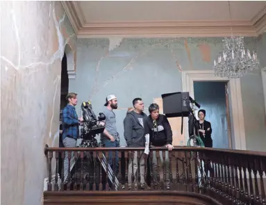  ??  ?? Abetted by a who’s who of Memphis film talent, director Mark Jones, third from left, shoots “Winding Brook” at Annesdale Mansion.