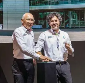  ??  ?? Petronas Lubricants Internatio­nal managing director and group chief executive officer Giuseppe D’Arrigo (right) and its chief technology officer Eric Holthusen launching the Petronas iona range of e-fluids at the Geneva Internatio­nal Motor Show 2019.