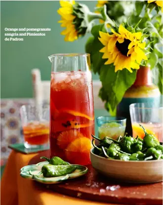  ??  ?? Orange and pomegranat­e sangria and Pimientos de Padron